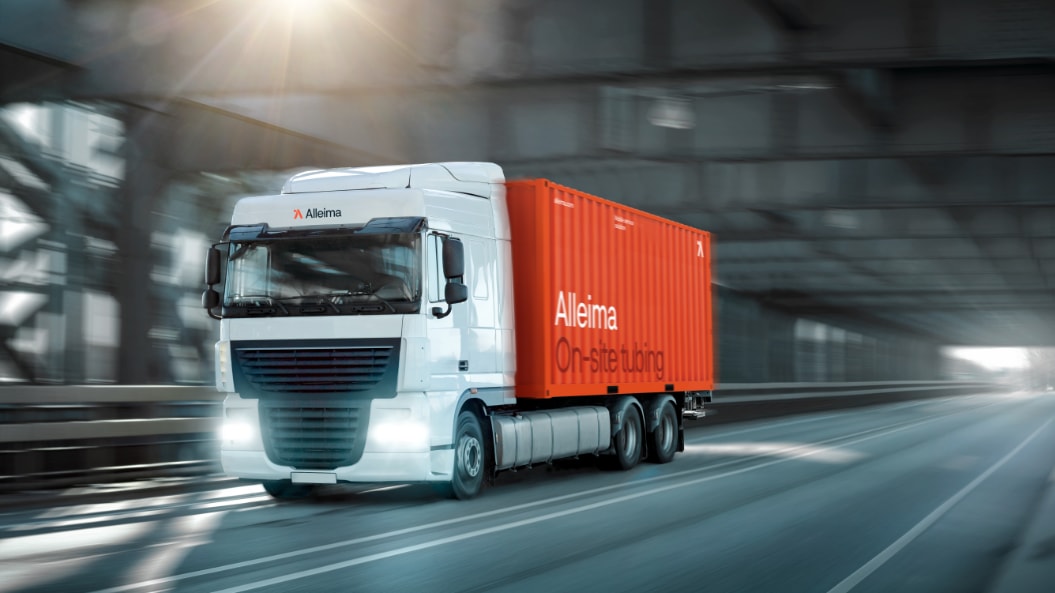 a white truck with red container on the side