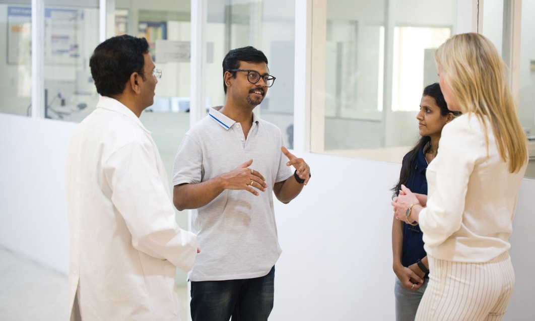 a group of people standing in a room