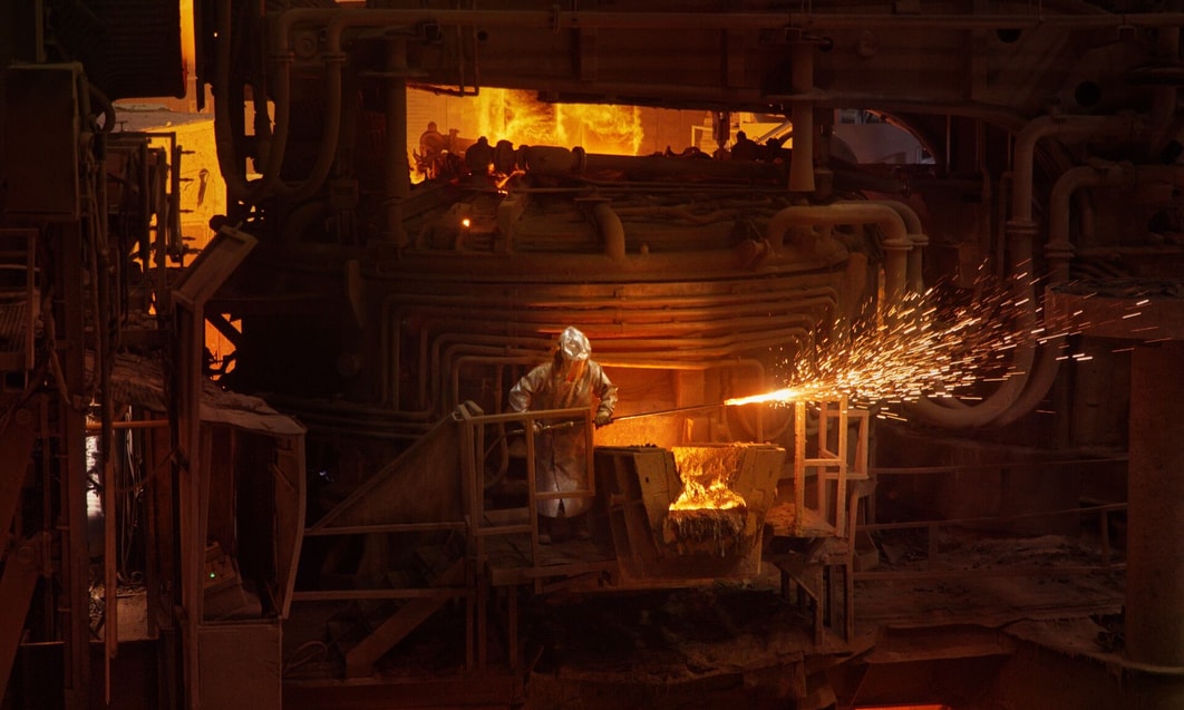 a person in a mask working in a factory