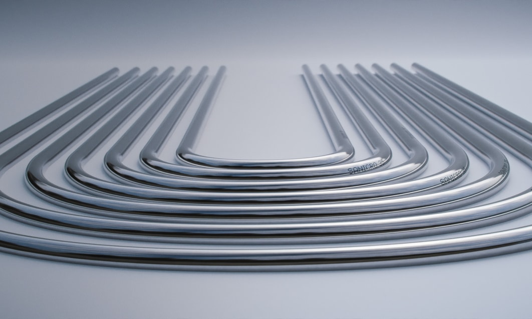 a group of silver pipes