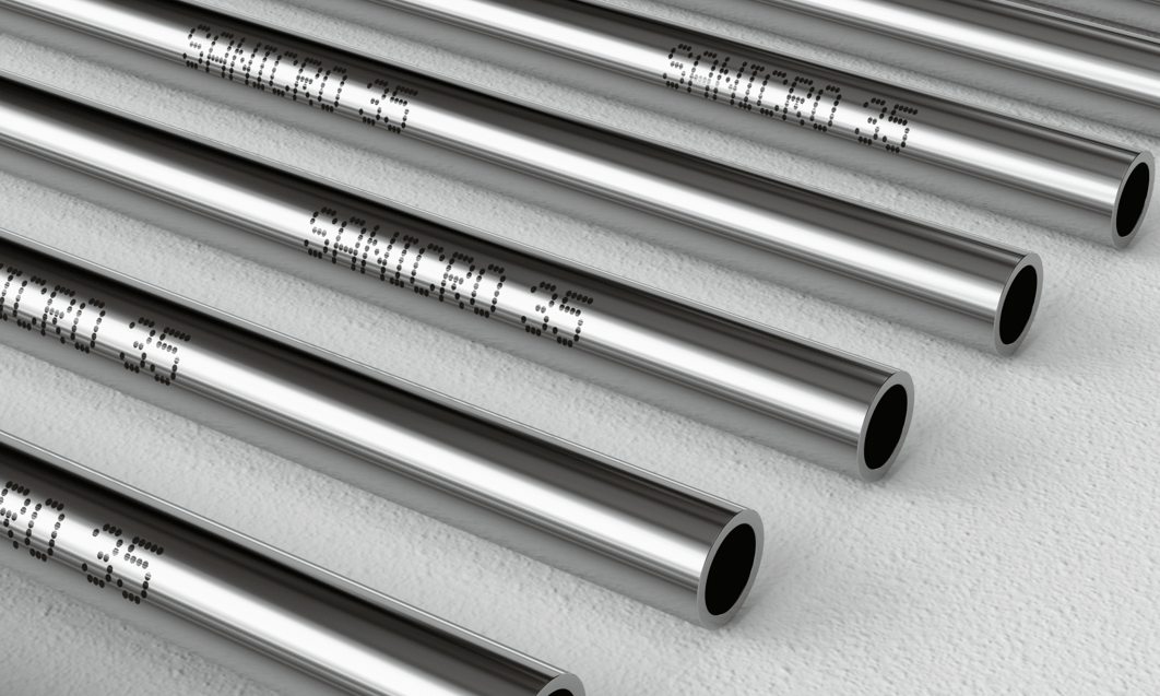 several metal pipes with writing on them