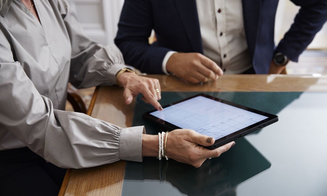 a person and person using a tablet