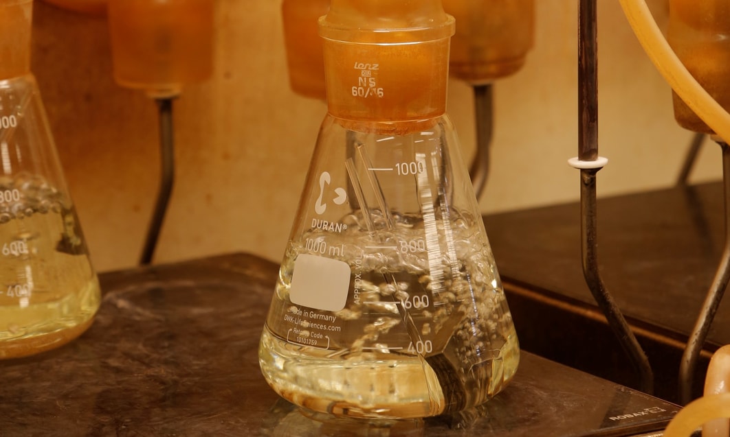 a beaker with liquid in it