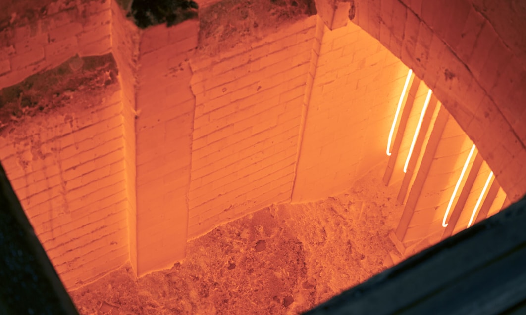 a brick wall with a light in the middle