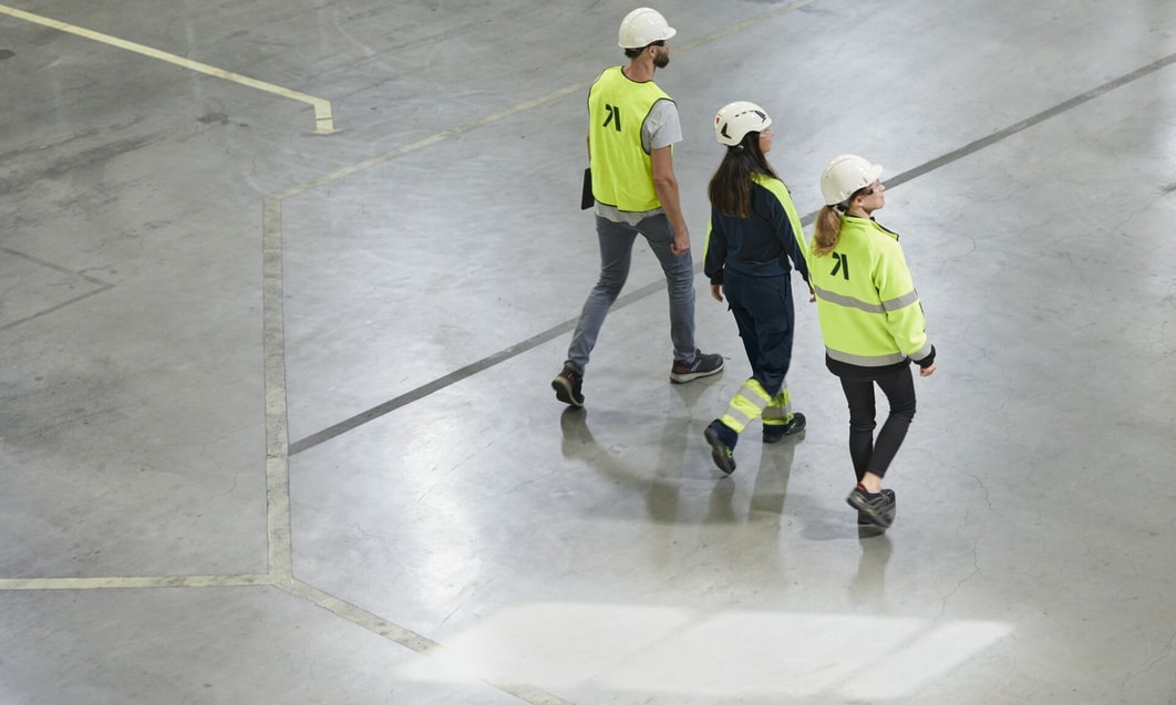 a group of people walking in a building