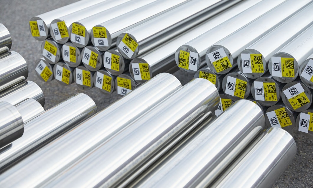 a group of metal tubes with yellow labels