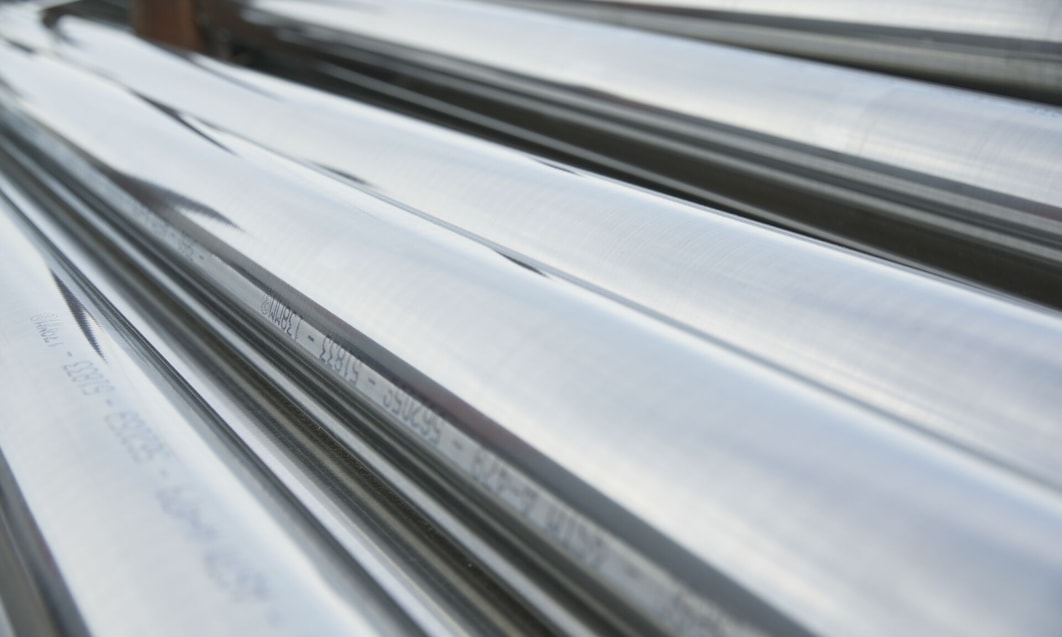 close up of a group of shiny metal pipes