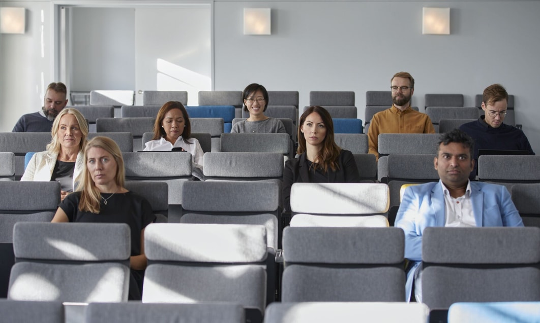 a group of people sitting in a room