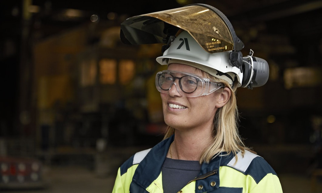 a person wearing a safety helmet and goggles