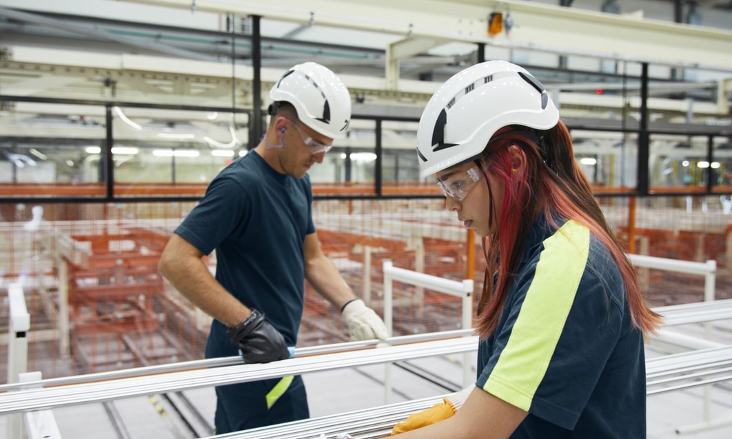 a person and person wearing hard hats