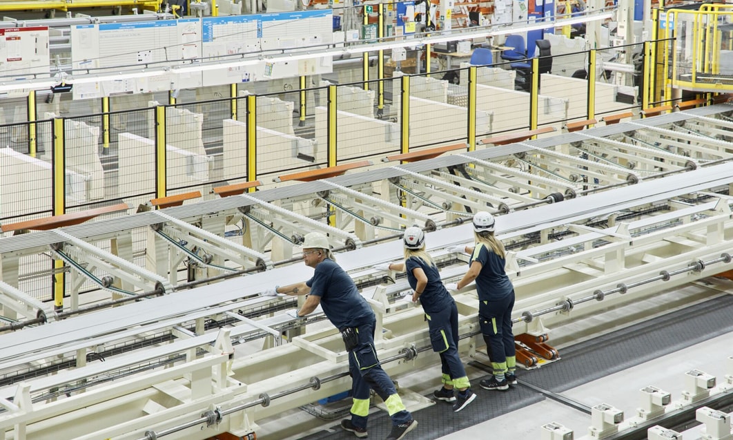 a group of people working in a factory