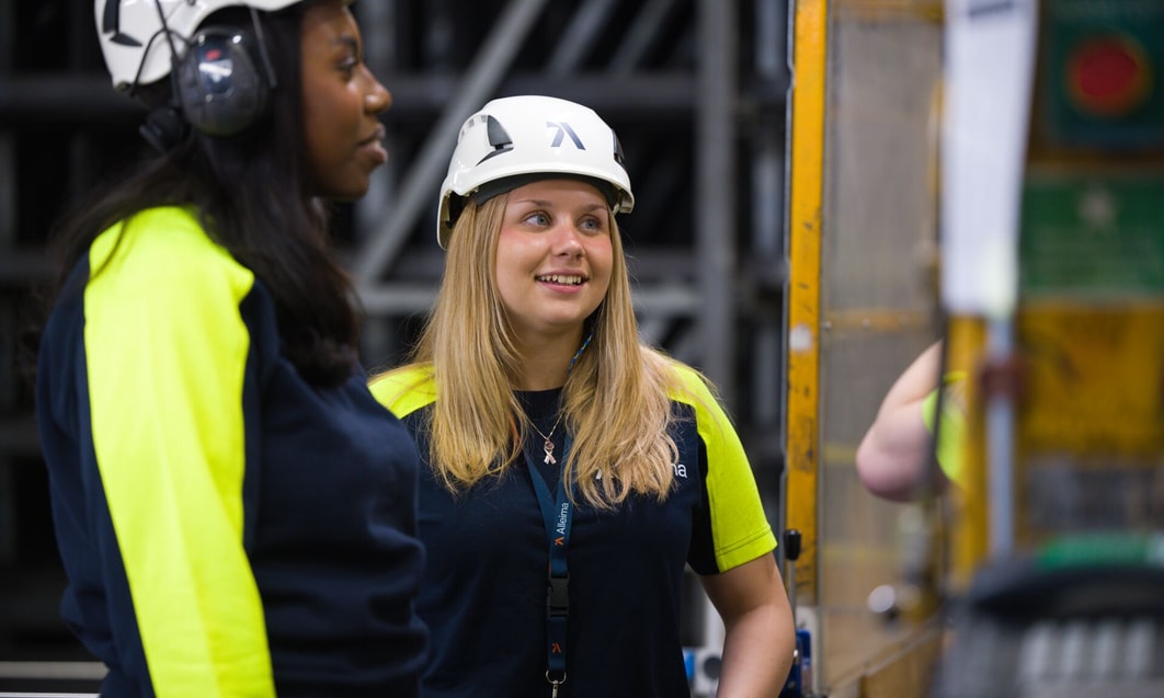 a person wearing a hard hat and a safety vest