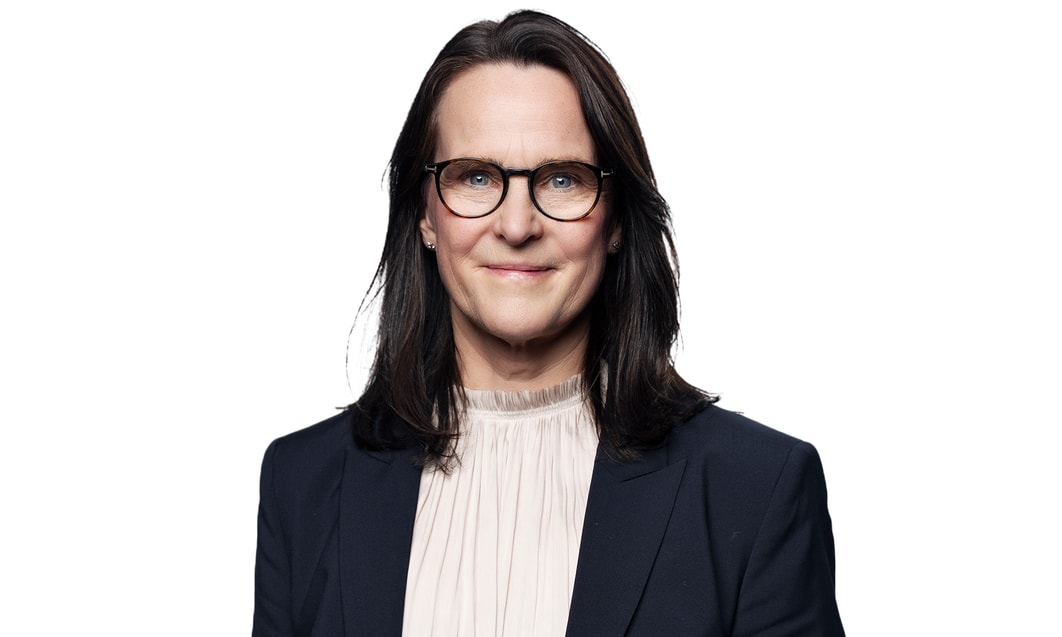 a person with long hair wearing glasses