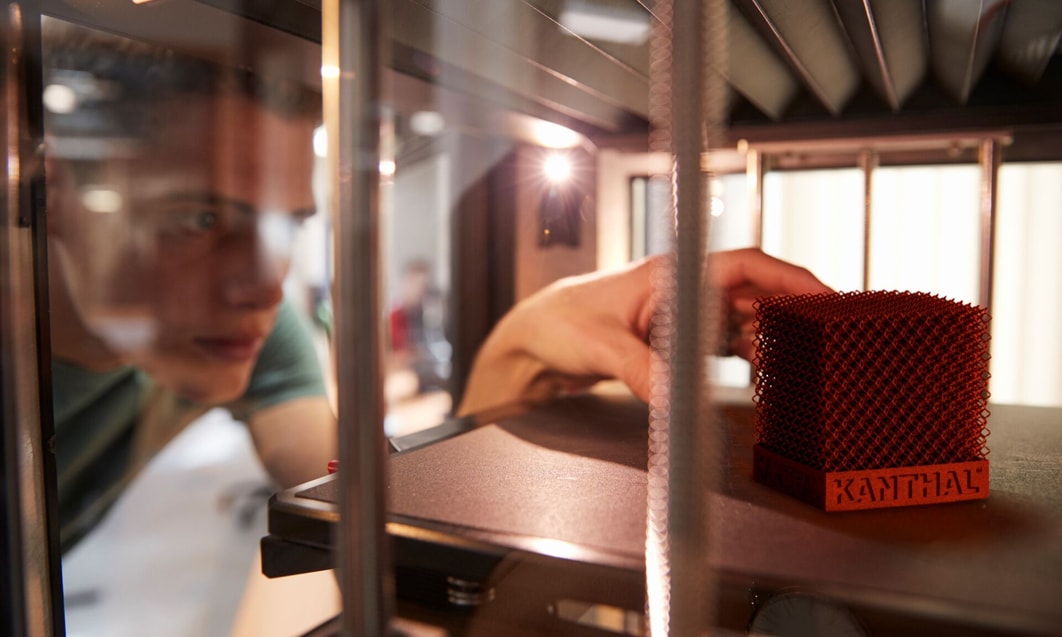 a person looking at a small cube