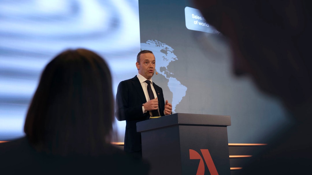 a person standing at a podium