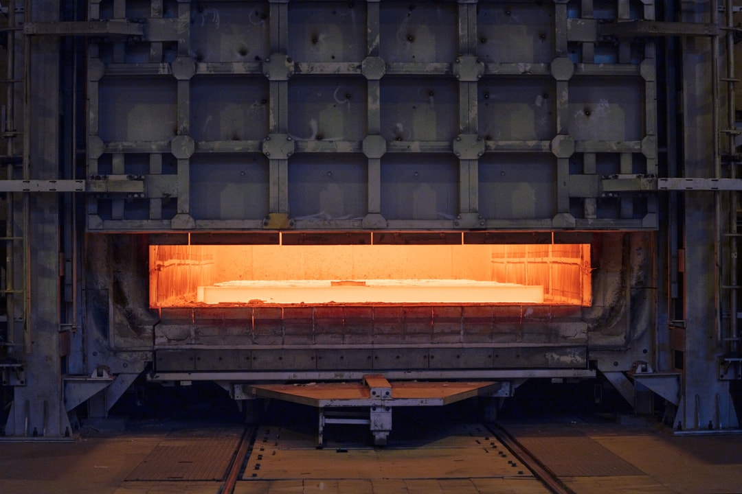 a large metal oven with a yellow light inside