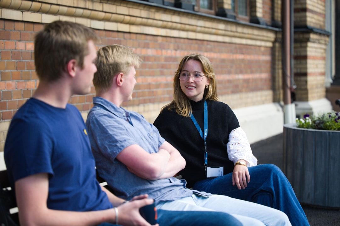 a group of people sitting on a bench