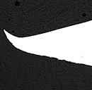 a black and white photo of a curved object