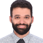 a person with a beard and mustache wearing a tie