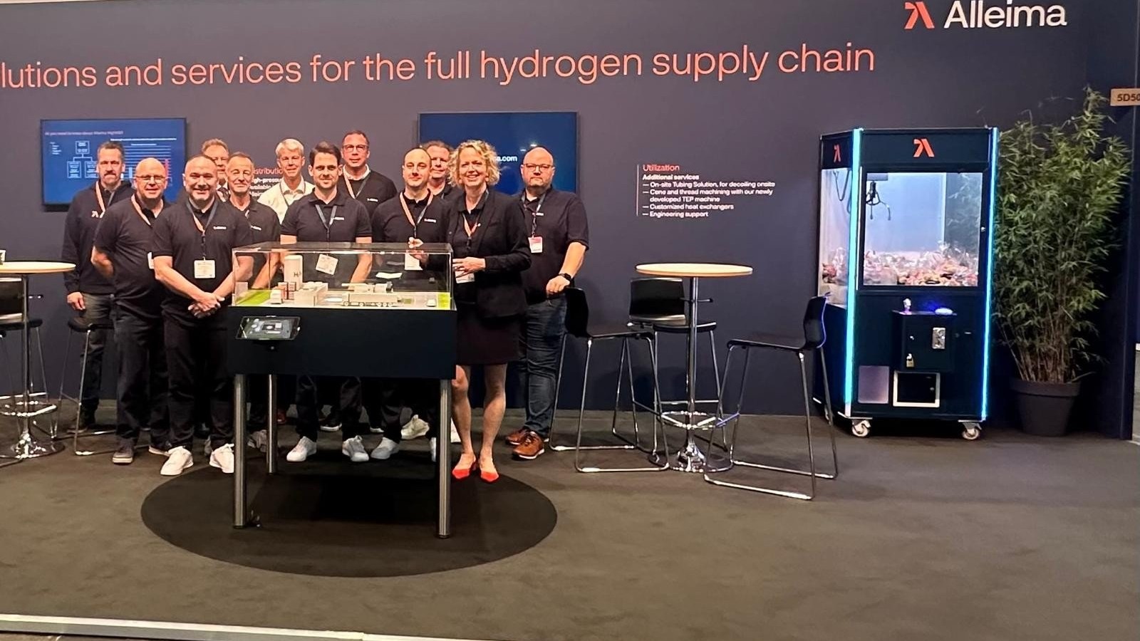 a group of people standing in front of a sign