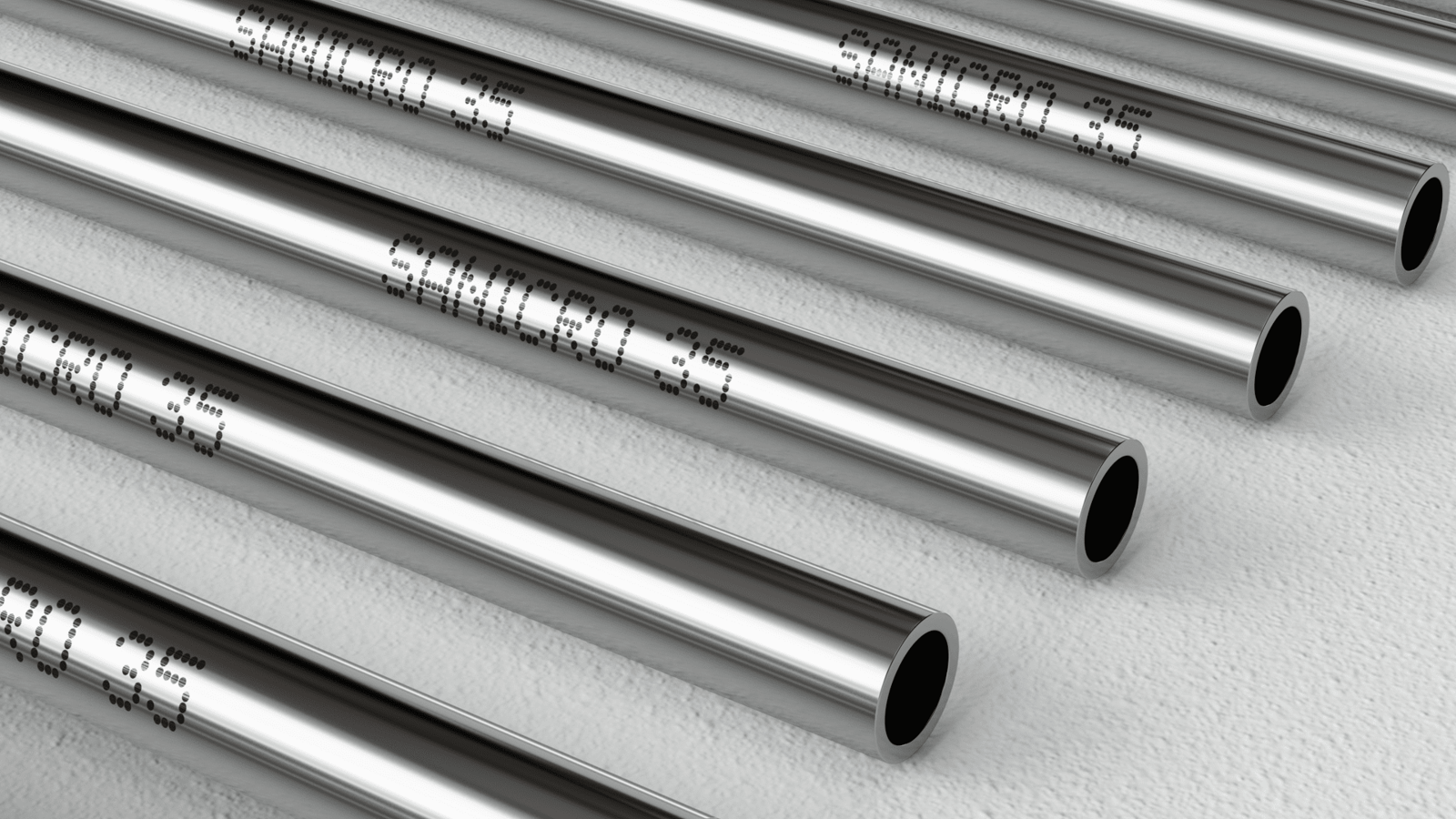 several metal pipes with writing on them