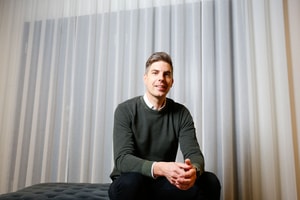 a person sitting on a bed