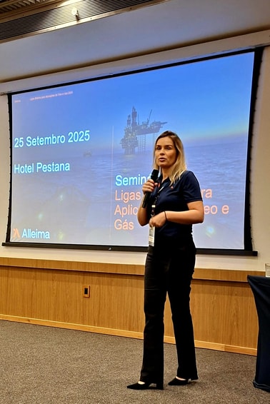 a person standing in front of a screen