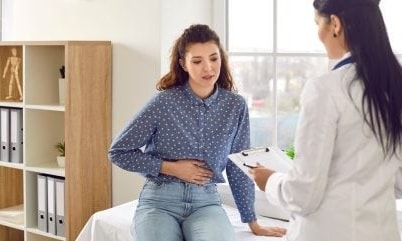 a person sitting on a table with a clipboard