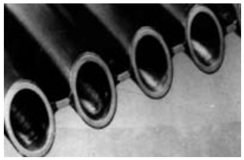 a group of pipes with holes