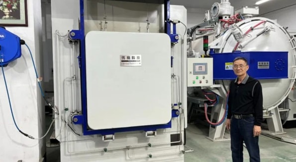 Mr. Situ of Weigao, China by his heat treatment furnace.