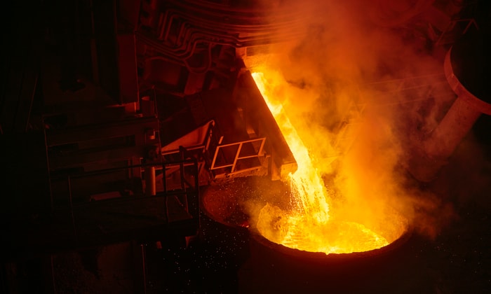 a large container with liquid pouring out of it