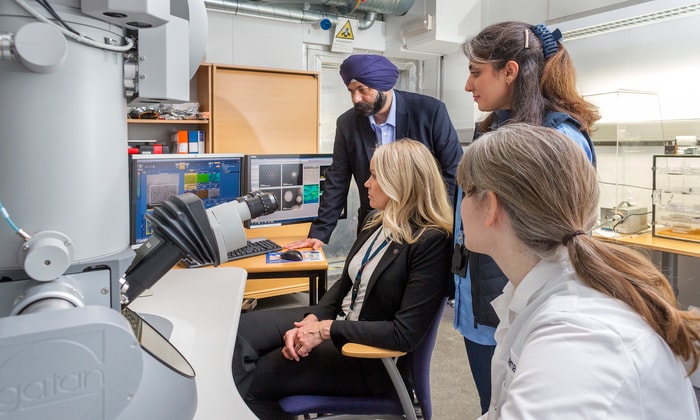 a group of people looking at a computer screen