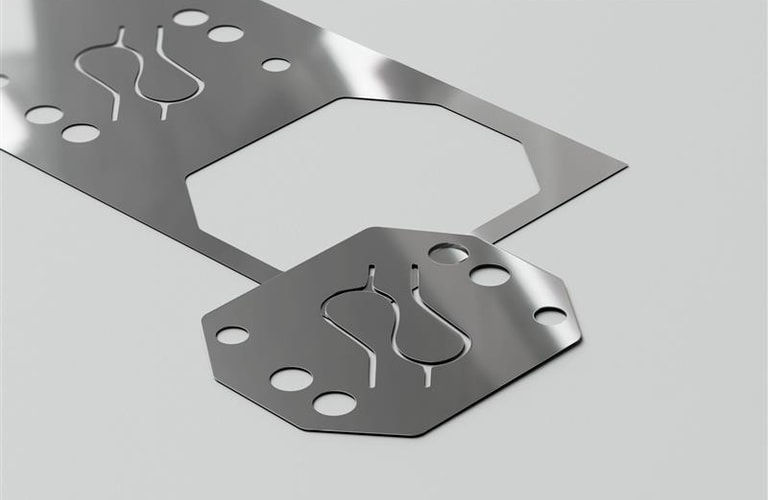 a metal plate with holes