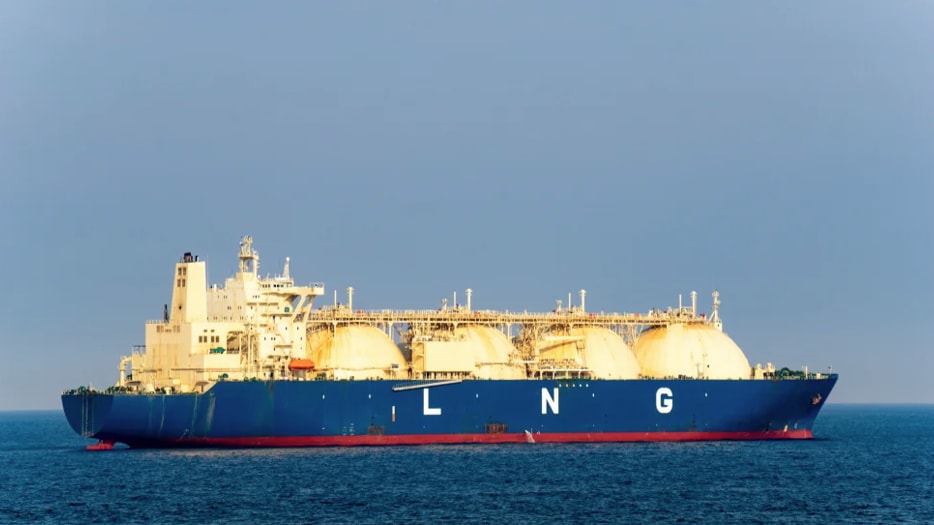 a large blue ship with white letters on it